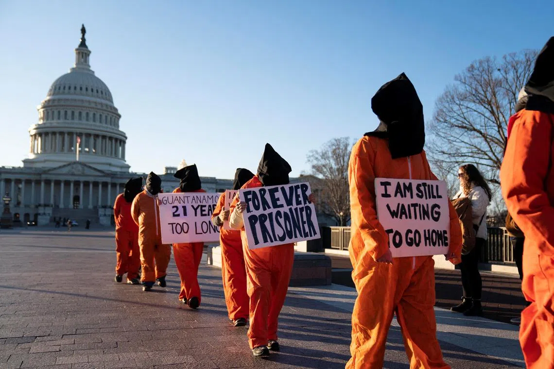 A group of people dressed as prisoners protest Guantanamo Bay Detention Camp outside of the U.S. Capitol in Washington, D.C., U.S., January 9, 2023. REUTERS/Sarah Silbiger