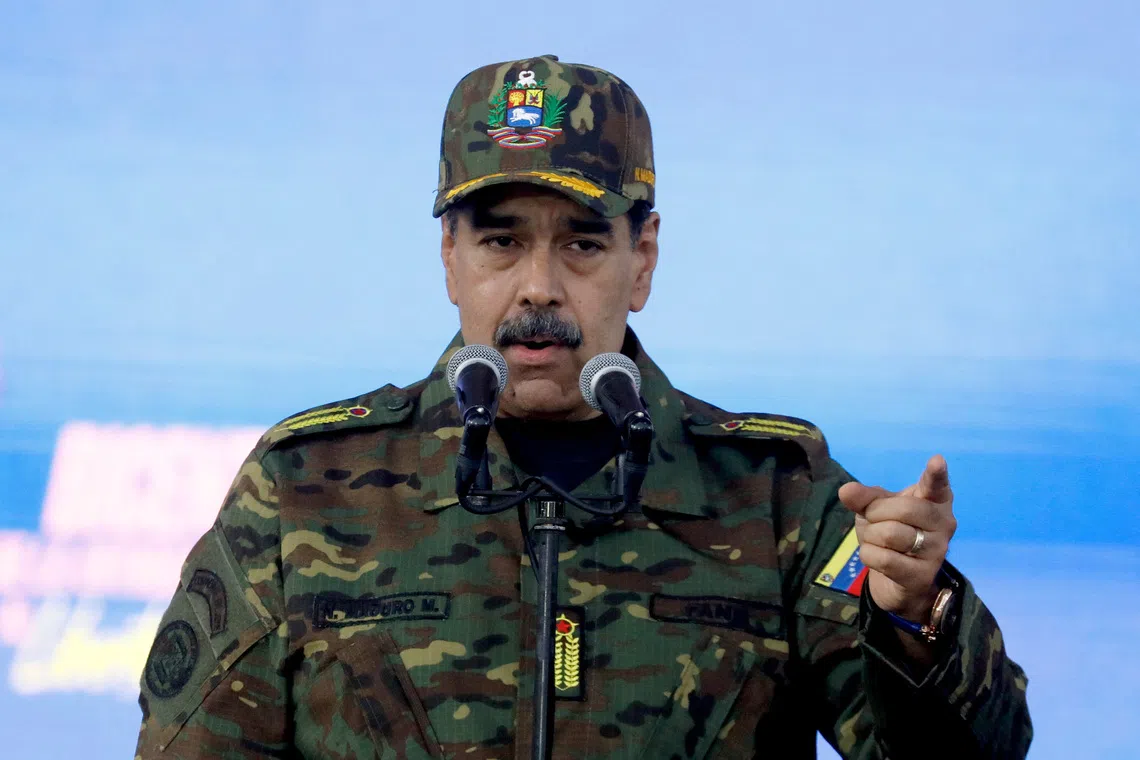 Venezuela's President Nicolas Maduro addresses members of the armed forces, Bolivarian Militia, police, and civilians during a rally against a possible escalation of U.S. actions toward the country, at Fort Tiuna military base in Caracas, Venezuela, November 25, 2025. REUTERS/Leonardo Fernandez Viloria