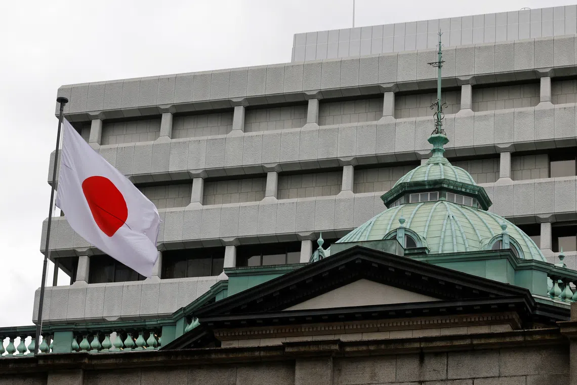 A Japanese flag flutters atop the Bank of Japan headquarters in Tokyo, Japan, on Sept 18, 2026.
