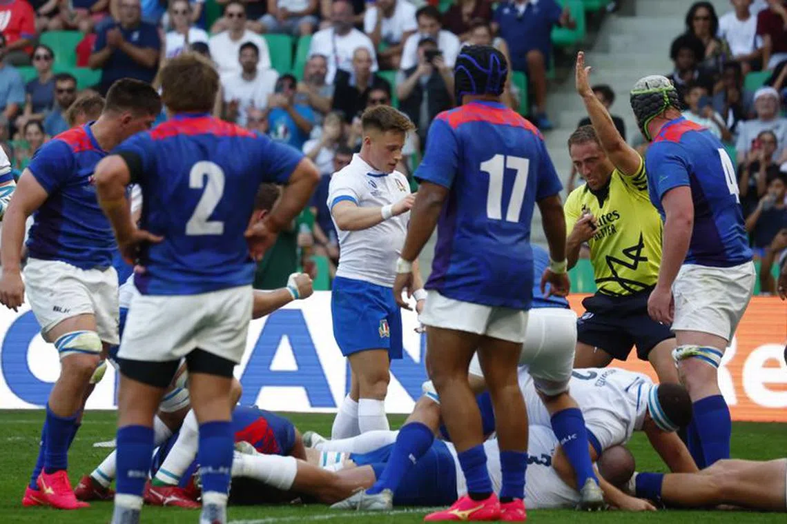 FILE PHOTO: Rugby Union - Rugby World Cup 2023 - Pool A - Italy v Namibia - Stade Geoffroy-Guichard, Saint-Etienne, France - September 9, 2023 Italy&#039;s Dino Lamb scores their third try REUTERS/Gonzalo Fuentes/File Photo