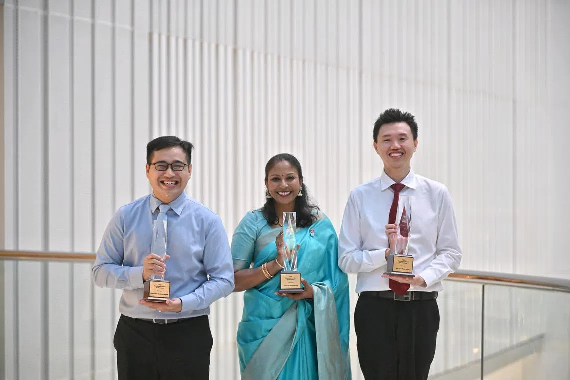 (From left) Mr Abdul Hadi Bin Abdul Wahab, Madam Usha Krishnasamy and Mr Max Chua Kang Loong at the MOE Teacher's Day reception on Sept 4.