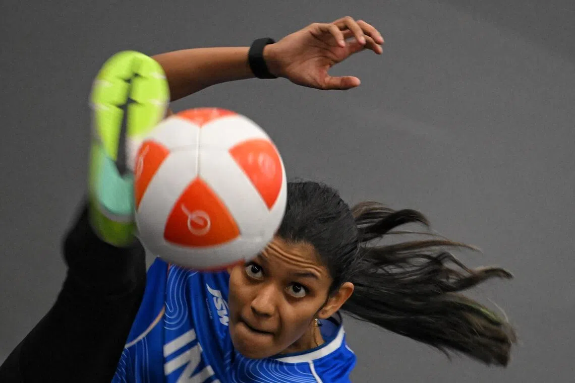 Quimcy Joaquim Dsouza of India in action against Sumaya of Indonesia during the Teqball Women’s singles semifinals held at the Nagoya City Higashi Sports Centre on Sept 19.
