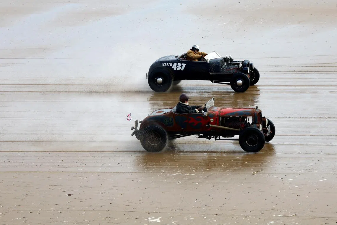 Motoring enthusiasts taking part in the 'Race The Waves' classic car and motorcycle meet at the beach in Bridlington, Britain on April 22, 2023.