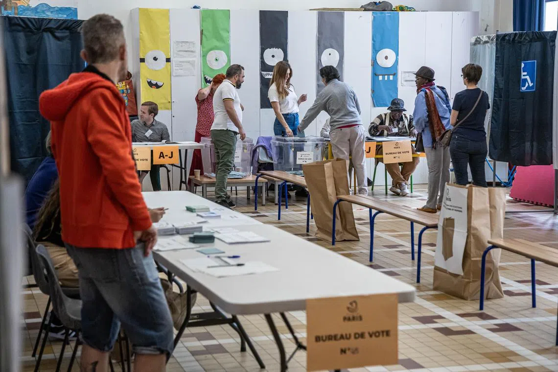 Voters at a polling station in Paris on July 7.