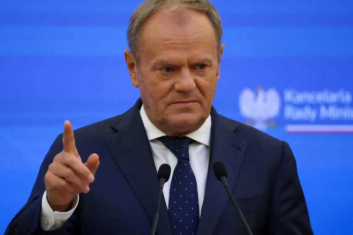 Poland's Prime Minister Donald Tusk gestures during a press conference with Lithuania's new Prime Minister Inga Ruginiene at the Chancellery of the Prime Minister in Warsaw, Poland, October 7, 2025. REUTERS/Kacper Pempel