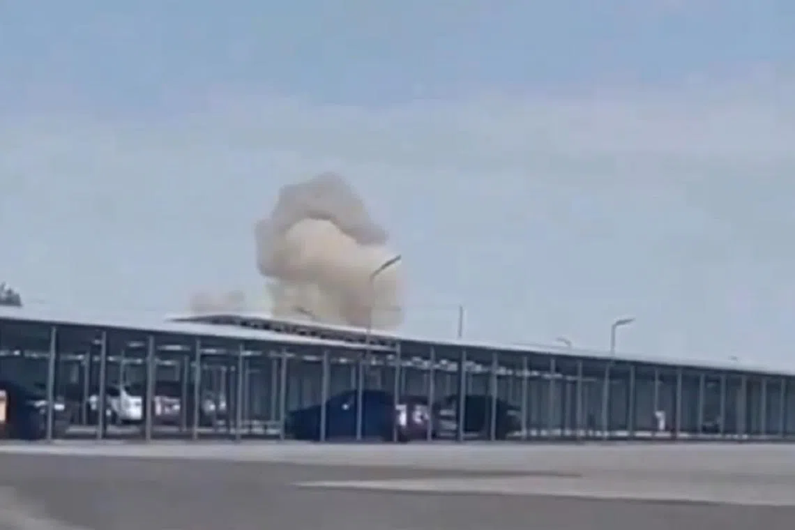 A screenshot from a video posted to social media of a drone hitting a military airfield in North Ossetia.