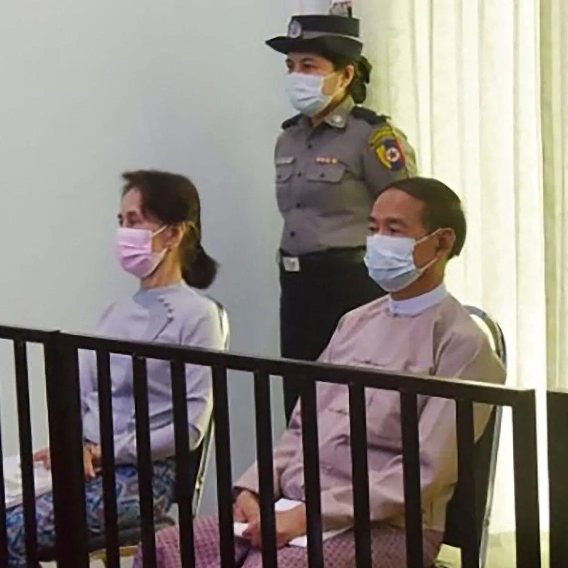 Myanmar's former Myanmar leader Aung San Suu Kyi and president Win Myint in court in May 2021.