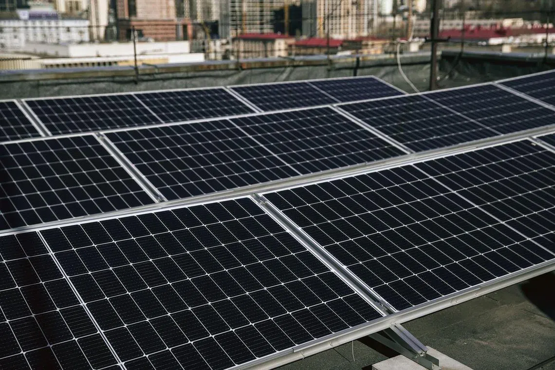 Solar panels of a rooftop array in Kyiv, Ukraine, on March 2.