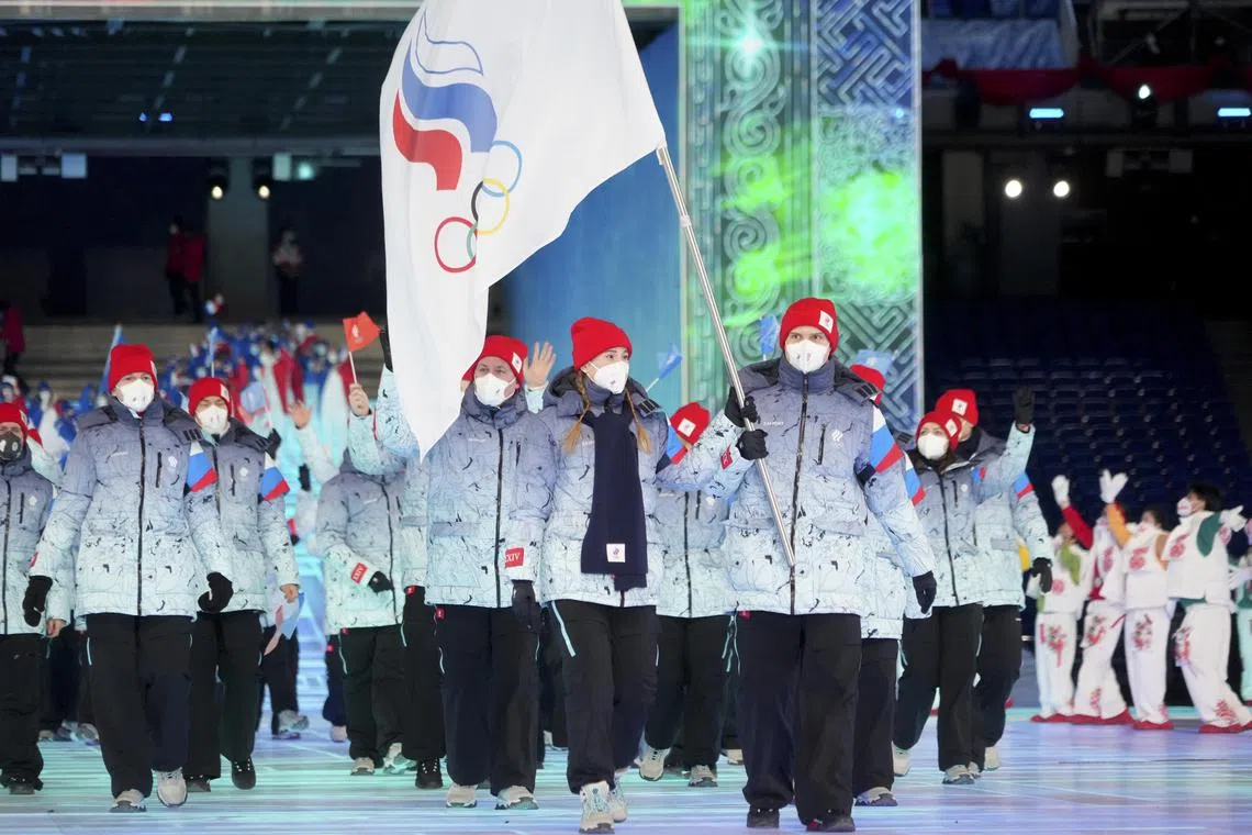 Russian athletes competing under the banner of the Russian Olympic Committee march during the opening ceremony of the 2022 Beijing Winter Olympics.