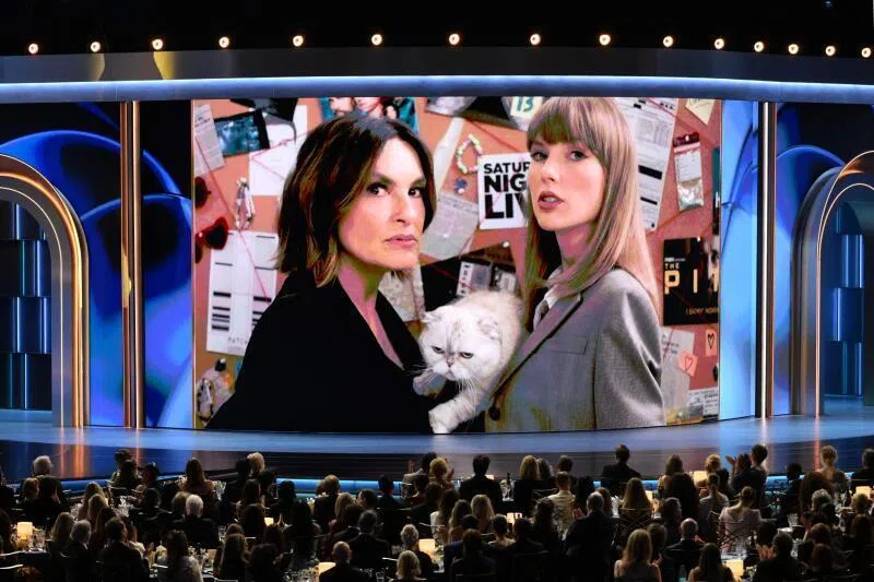 Mariska Hargitay, Taylor Swift, and her cat Olivia Benson appear on screen during the Emmy Awards on Sept 14.