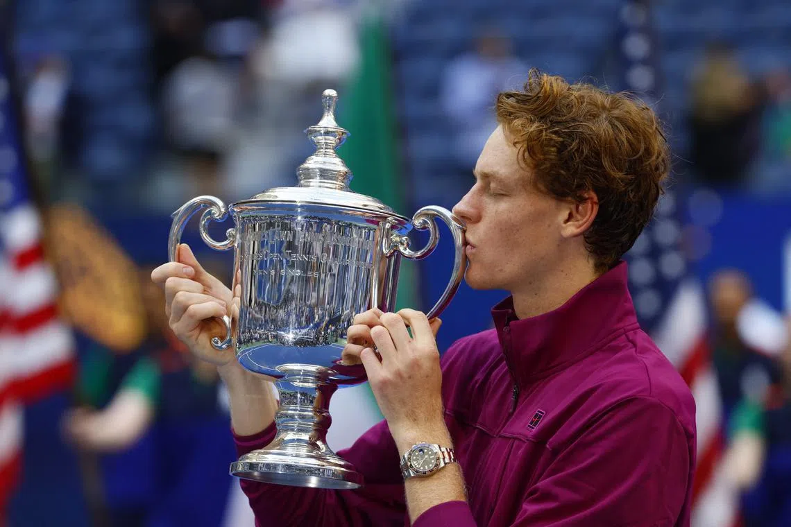 Sep 8, 2024; Flushing, NY, USA; Jannik Sinner (ITA) celebrates with the trophy after defeating Taylor Fritz (USA) in the men’s singles final of the 2024 U.S. Open tennis tournament at USTA Billie Jean King National Tennis Center. Mandatory Credit: Mike Frey-Imagn Images