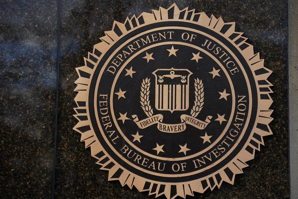 The logo of the Federal Bureau of Investigation (FBI) displayed on the building in Washington, D.C., U.S., November 28, 2025. REUTERS/Nathan Howard