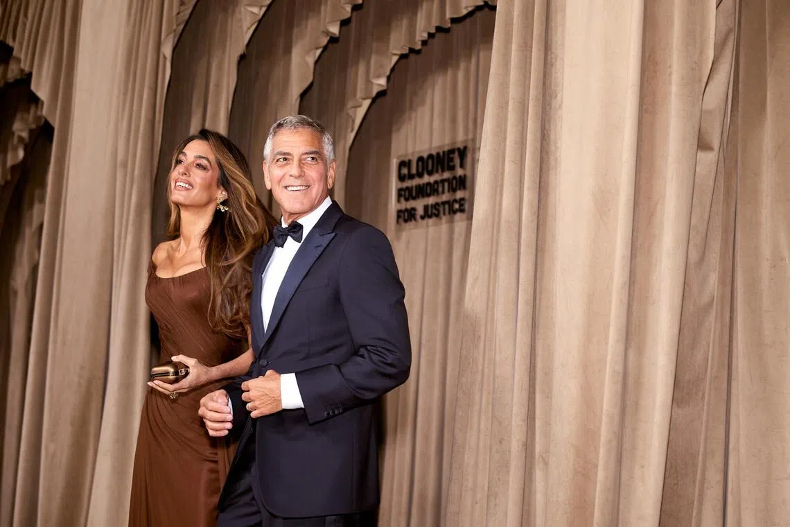 Amal and George Clooney at the 2025 Albie Awards, which celebrate individuals who have devoted their lives to justice, at the Natural History Museum in London on Oct 3. 