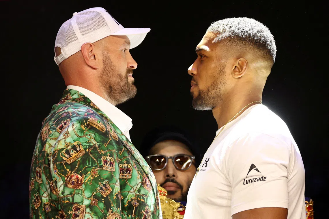 Boxing - Anthony Joshua & Tyson Fury Press Conference - British Airways ARC, London, Britain - September 30, 2026 Anthony Joshua and Tyson Fury face off as the Chairman of Saudi Arabia's General Entertainment Authority, Turki Al-Sheikh looks on during the press conference Action Images via Reuters/John Sibley
