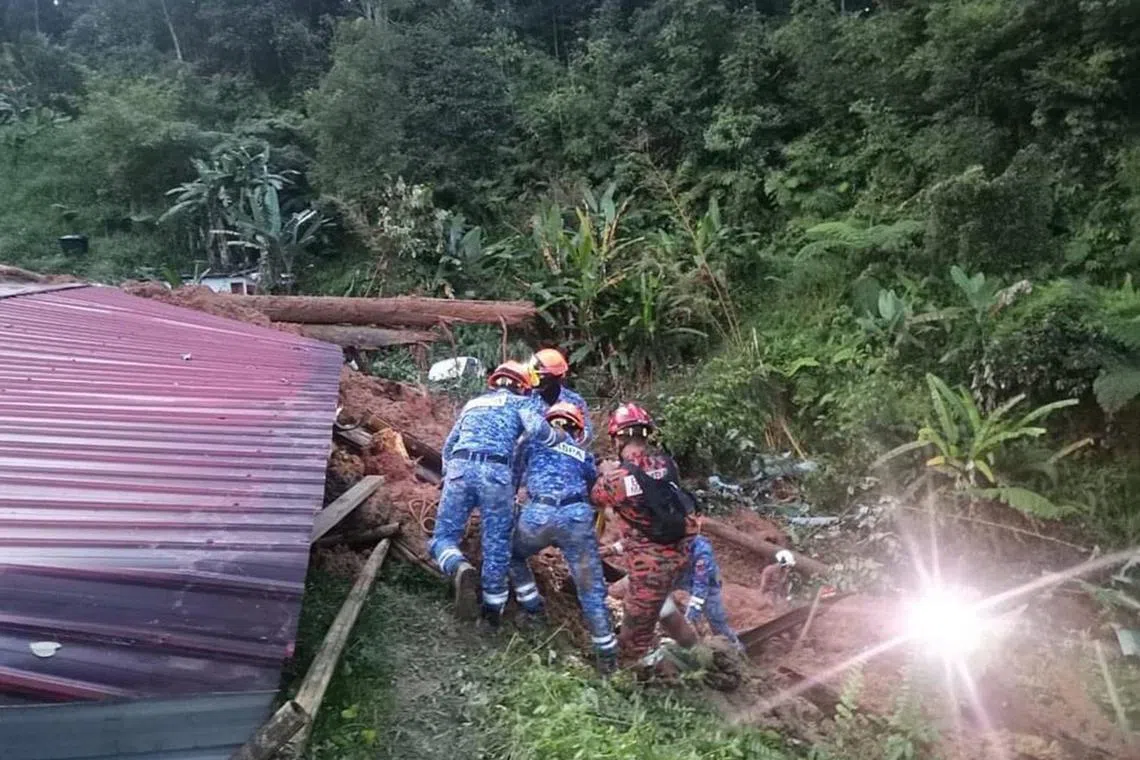 Civil defence personnel conducting search and rescue operations at the site of the landslide in Batang Kali, Selangor, on Dec 16, 2022.