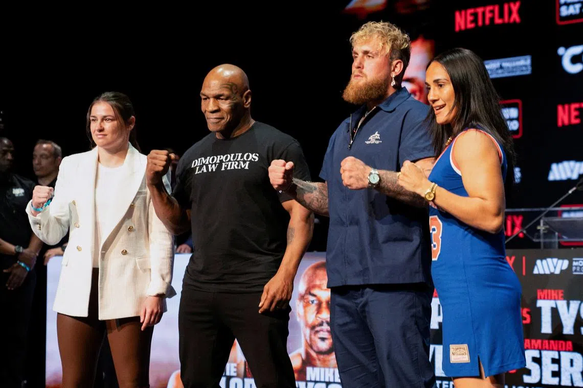 FILE PHOTO: Boxers Mike Tyson, Jake Paul, Katie Taylor, and Amanda Serrano attend a news conference, ahead of their postponed professional fight which was set to take place at AT&T Stadium in Arlington, Texas on July 20, in New York City, U.S., May 13, 2024. REUTERS/David 'Dee' Delgado/File Photo