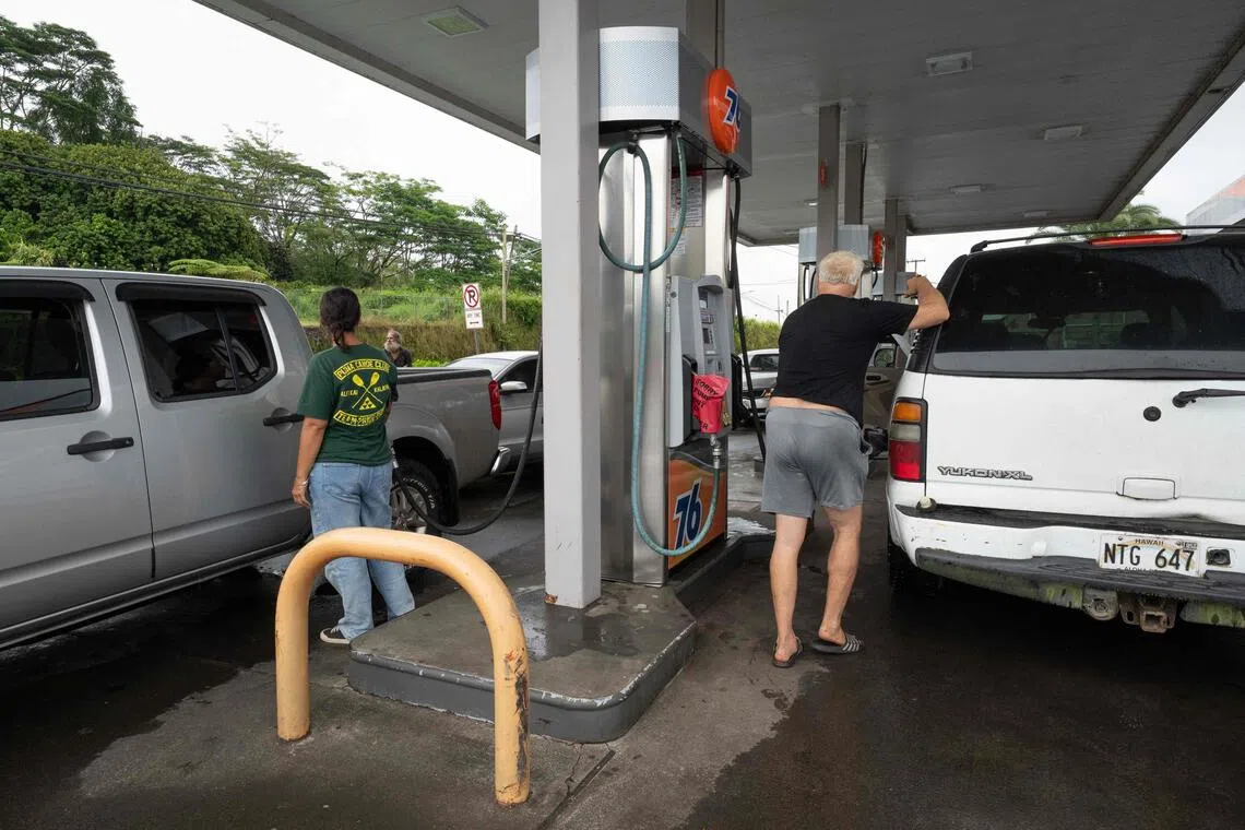 Residents filling their cars with gas on Aug 14 in preparation for the arrival of Tropical Storm Lala to the big island of Hawaii.
