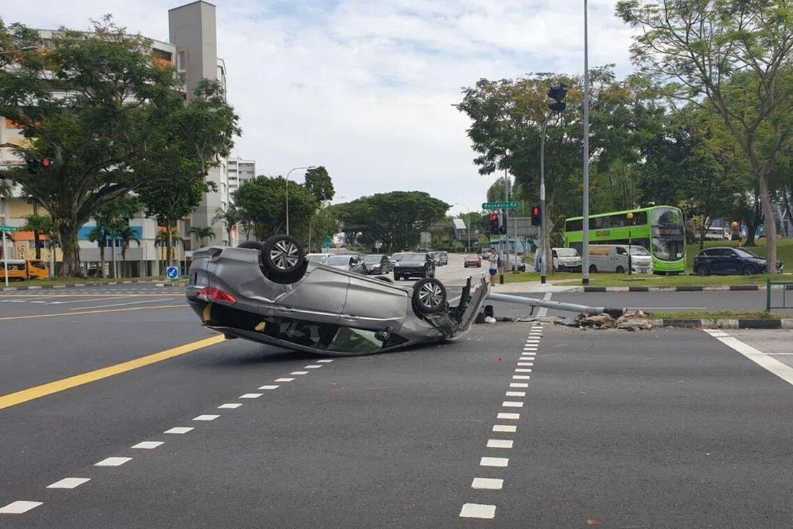 The car driven by the man overturned after it collided into a traffic light pole at the junction of Yio Chu Kang Link and Boundary Road on Feb 2, 2025.