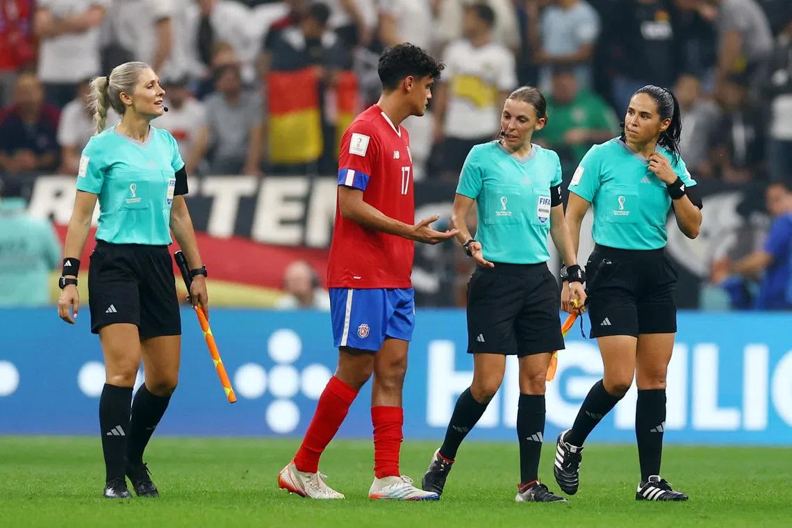 Costa Rica's Yeltsin Tejeda talking to referee Stephanie Frappart (second from right) and assistant referees Neuza Back and Karen Diaz. 