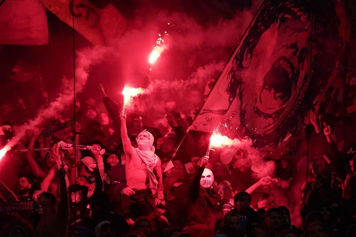 Marseille's supporters lighting flares during the UEFA Champions League football match between Olympique de Marseille (OM) and Liverpool FC at the Stade Velodrome in Marseille, southern France on Jan 21, 2026. 