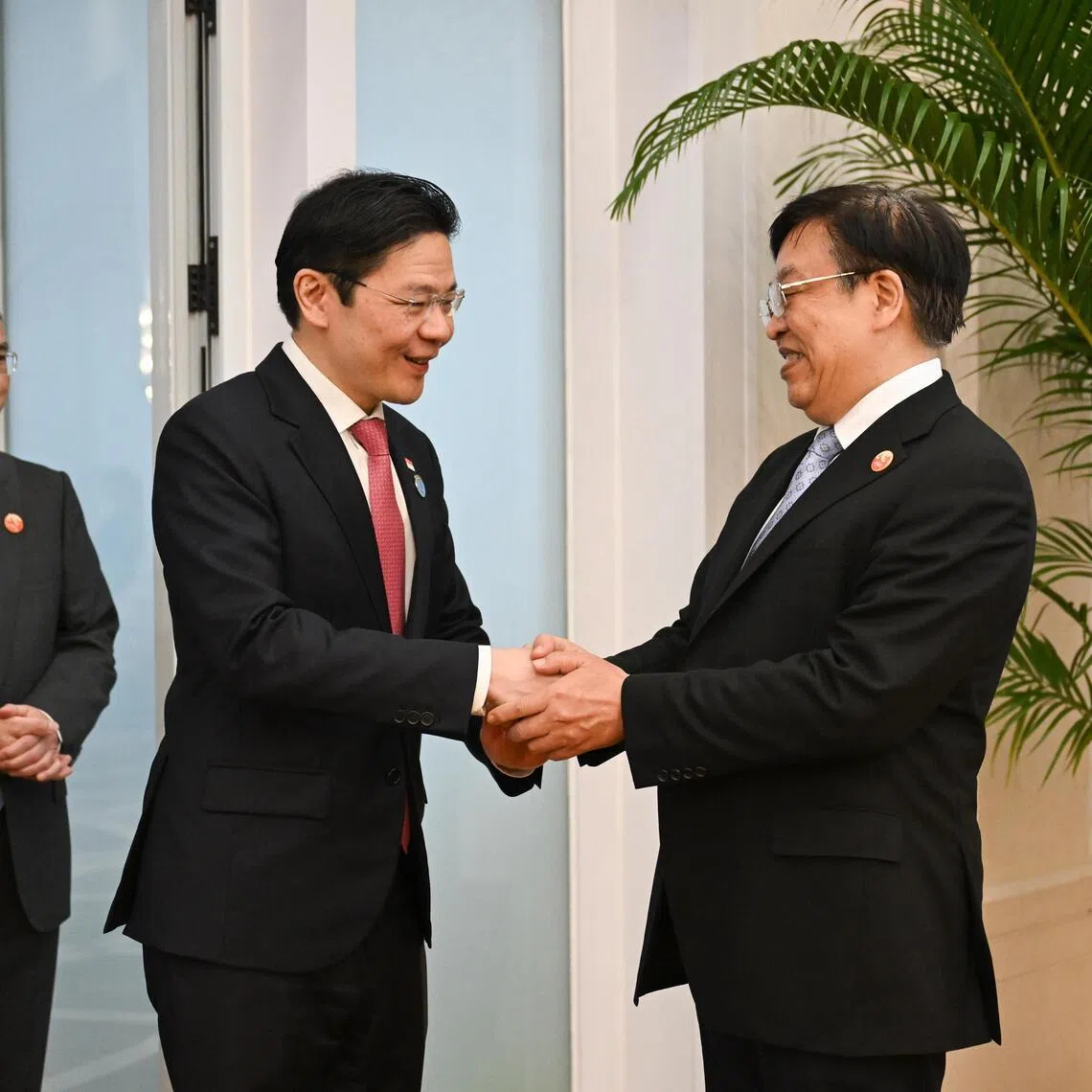 Prime Minister Lawrence Wong with Hainan Communist Party secretary Feng Fei on March 26. Both agreed that Singapore and Hainan have much to gain from cooperation. 