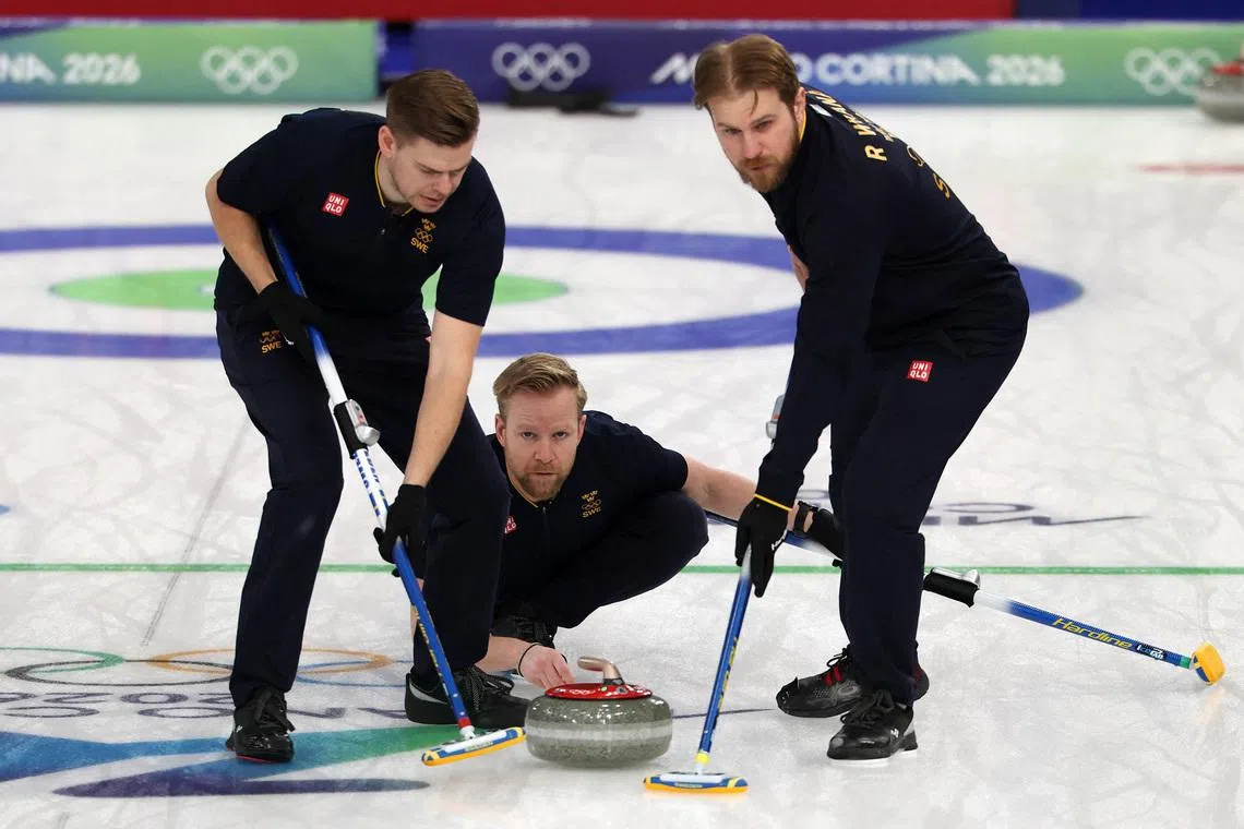 Milano Cortina 2026 Olympics - Curling - Men's Round Robin Session 12 - Sweden vs Czech Republic - Cortina Curling Olympic Stadium, Cortina d'Ampezzo, Italy - February 19, 2026. Niklas Edin of Sweden, Rasmus Wranaa of Sweden and Christoffer Sundgren of Sweden in action during the match against Czech Republic REUTERS/Issei Kato