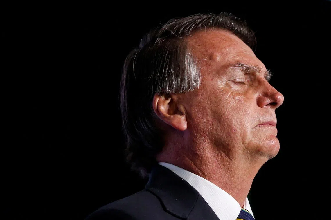 FILE PHOTO: Former Brazilian President Jair Bolsonaro closes his eyes during \"Power of The People\" event hosted by Turning Point USA at Trump National Doral Miami Resort in Doral, Florida, U.S., February 3, 2023. REUTERS/Marco Bello/File Photo
