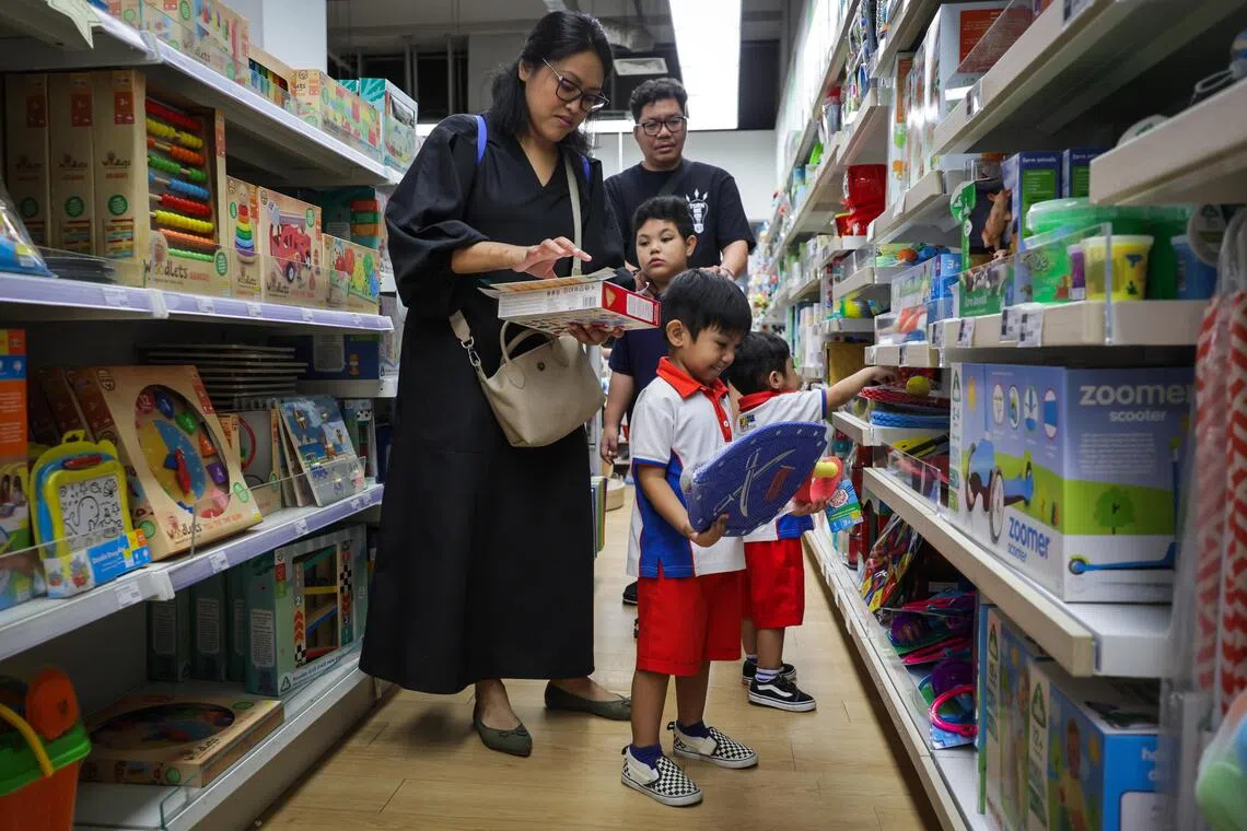 Beneficiaries browsing the merchandises during the launch of KidSTART Sparkle Homes at the Mothercare Experience Store @ HarbourFront Centre on 0ct 18, 2025.