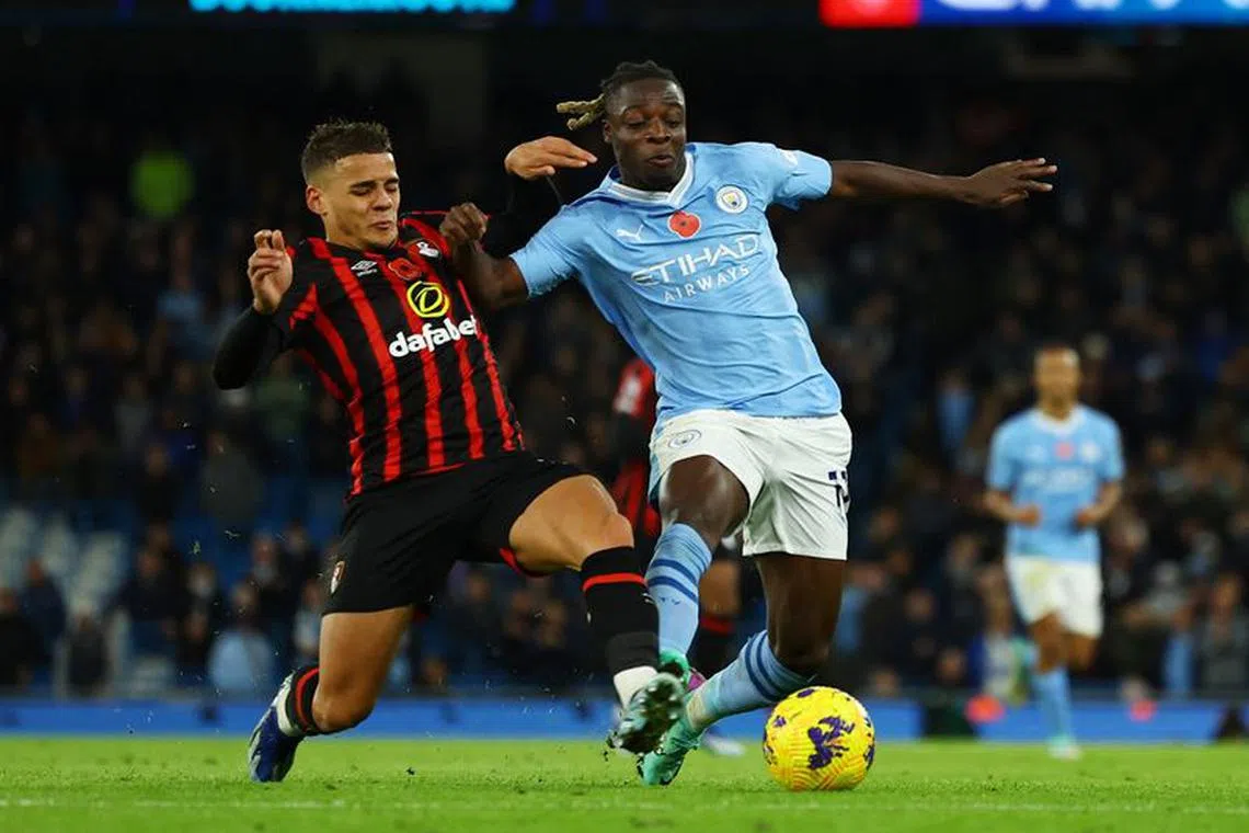 Soccer Football - Premier League - Manchester City v AFC Bournemouth - Etihad Stadium, Manchester, Britain - November 4, 2023 AFC Bournemouth's Max Aarons in action with Manchester City's Jeremy Doku REUTERS/Molly Darlington