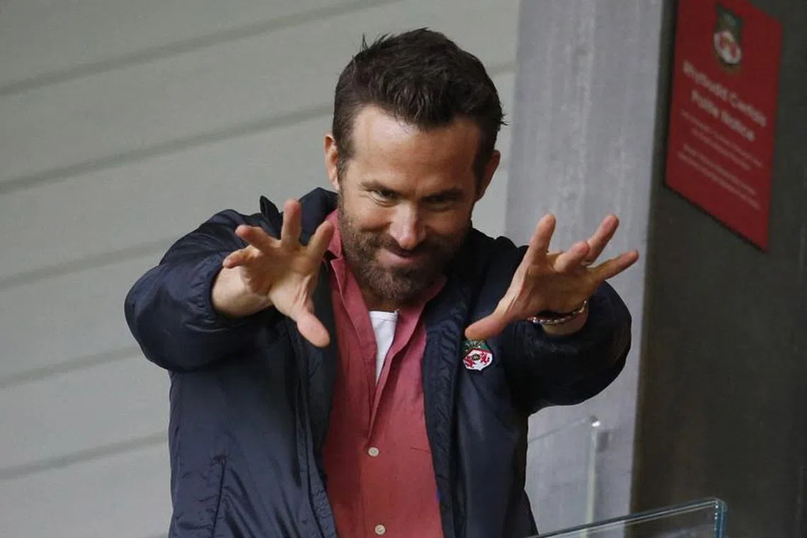 Soccer Football - England - League Two - Wrexham v Milton Keynes Dons - Racecourse Ground, Wrexham, Britain - August 5, 2023 Wrexham co-owner Ryan Reynolds reacts before the match Action Images via Reuters/Ed Sykes/File Photo