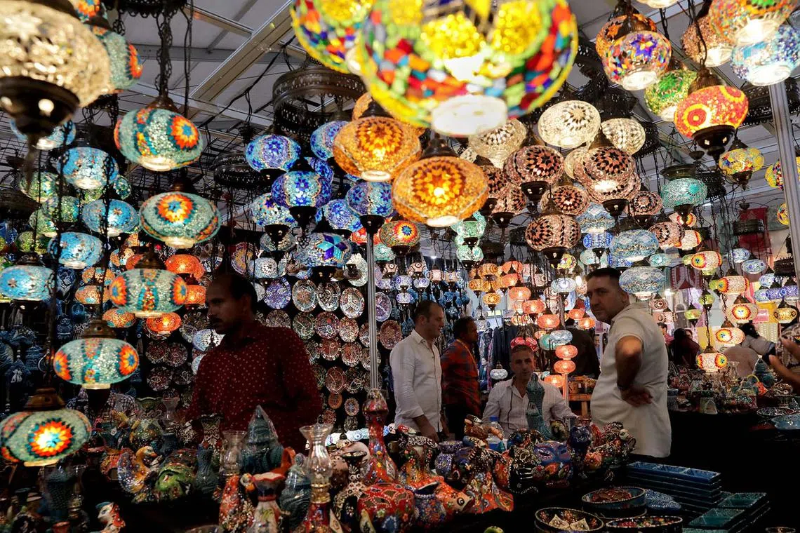 epa11037333 Crystal and porcelain made plates and light shades from Egypt are on display at a stand during the 19th International Trade Fair in Kolkata, eastern India, 19 December 2023. The fair runs from 14 to 31 December. EPA-EFE/PIYAL ADHIKARY