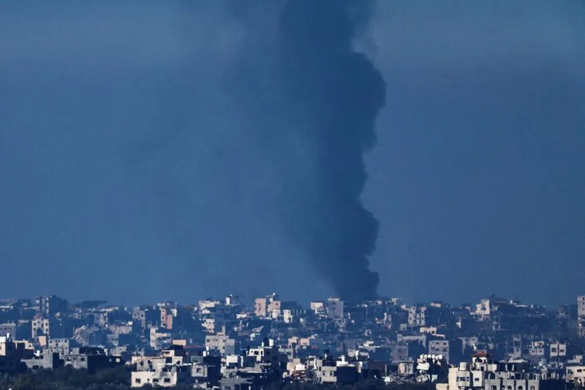 Smoke rises in Gaza, amid the ongoing conflict between Israel and the Palestinian Islamist group Hamas, as seen from Southern Israel, December 15, 2023. REUTERS/Clodagh Kilcoyne
