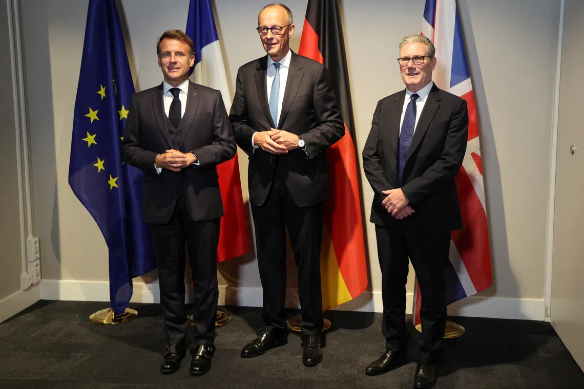 France's President Emmanuel Macron, Germany's Chancellor Friedrich Merz and Britain's Prime Minister Keir Starmer pose as they meet on the sidelines of the two-day NATO's Heads of State and Government summit, in The Hague, Netherlands June 24, 2025. Ludovic Marin/Pool via REUTERS