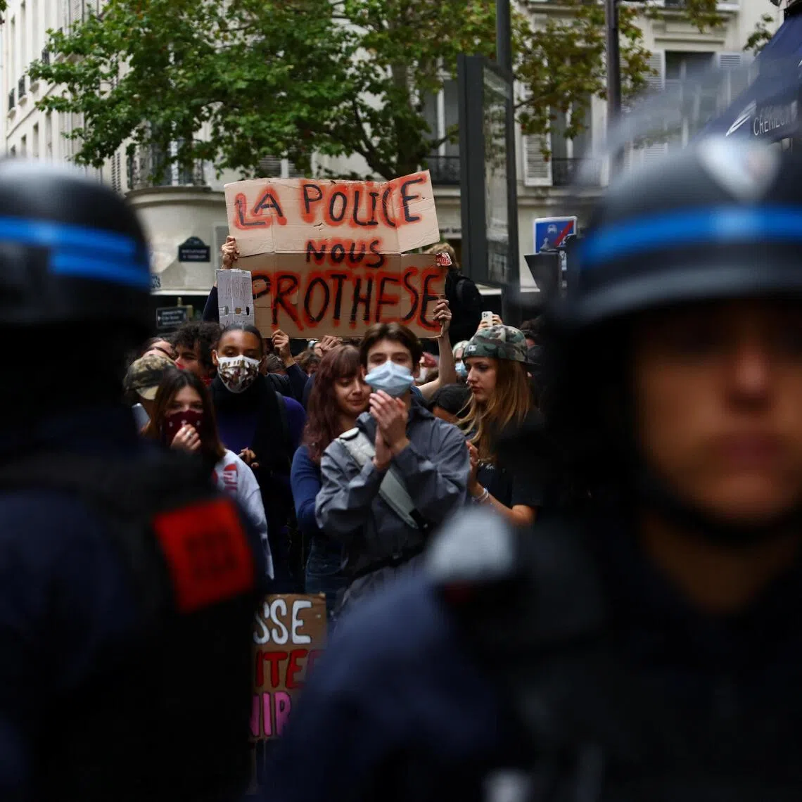 French riot police in position on Oct 7, as students block the street outside Sciences Po university in Paris as part of nationwide protests demanding better high school conditions.