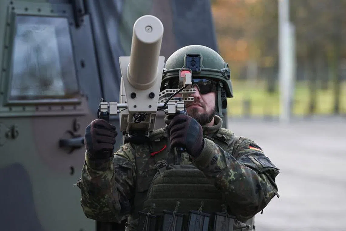A soldier holds a mobile jammer as part of an anti-drone system of German military Bundeswehr, in Bonn, Germany, November 16, 2023. REUTERS/Jana Rodenbusch/File Photo