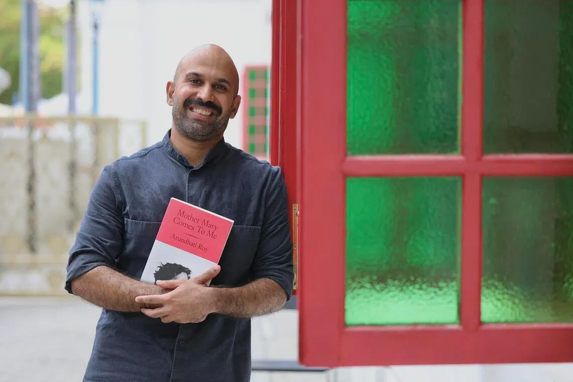 Shridar Mani, co-artistic director of The Opera People, likes to read on his commute. 
ST Photo: Hester Tan