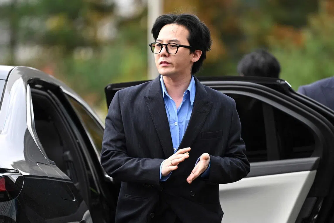 K-pop star G-Dragon arrives at a police station for his police questioning in Incheon on Nov 6, 2023. 