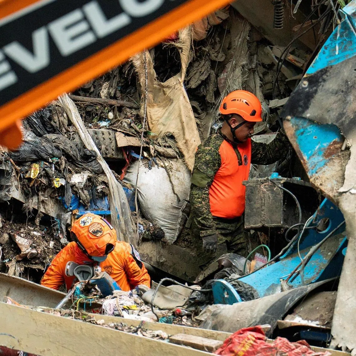 Workers conducting a rescue operation at the collapsed landfill in Binaliw, Cebu, on Jan 10. 