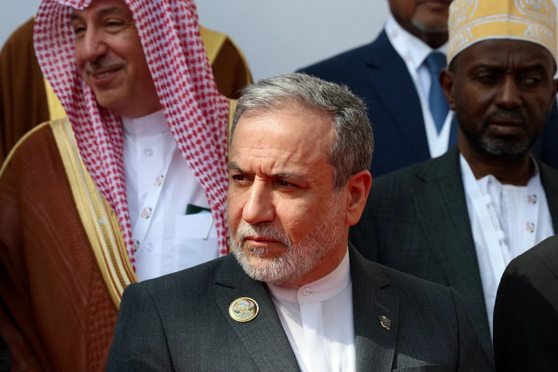 Iran's Foreign Minister Abbas Araghchi poses with other delegates for a family photo on the day of the 52nd OIC Council of Foreign Ministers opening session, in Baghdad, Iraq, October 17, 2026. REUTERS/Ahmed Saad