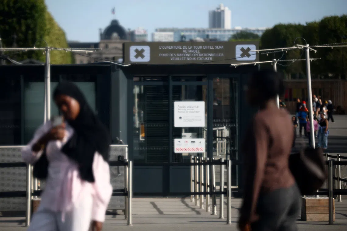 A sign reading \"the opening of the Eiffel Tower is delayed for operational reasons, we apologize\" is seen at the Eiffel Tower in Paris, France, September 7, 2026. REUTERS/Sarah Meyssonnier