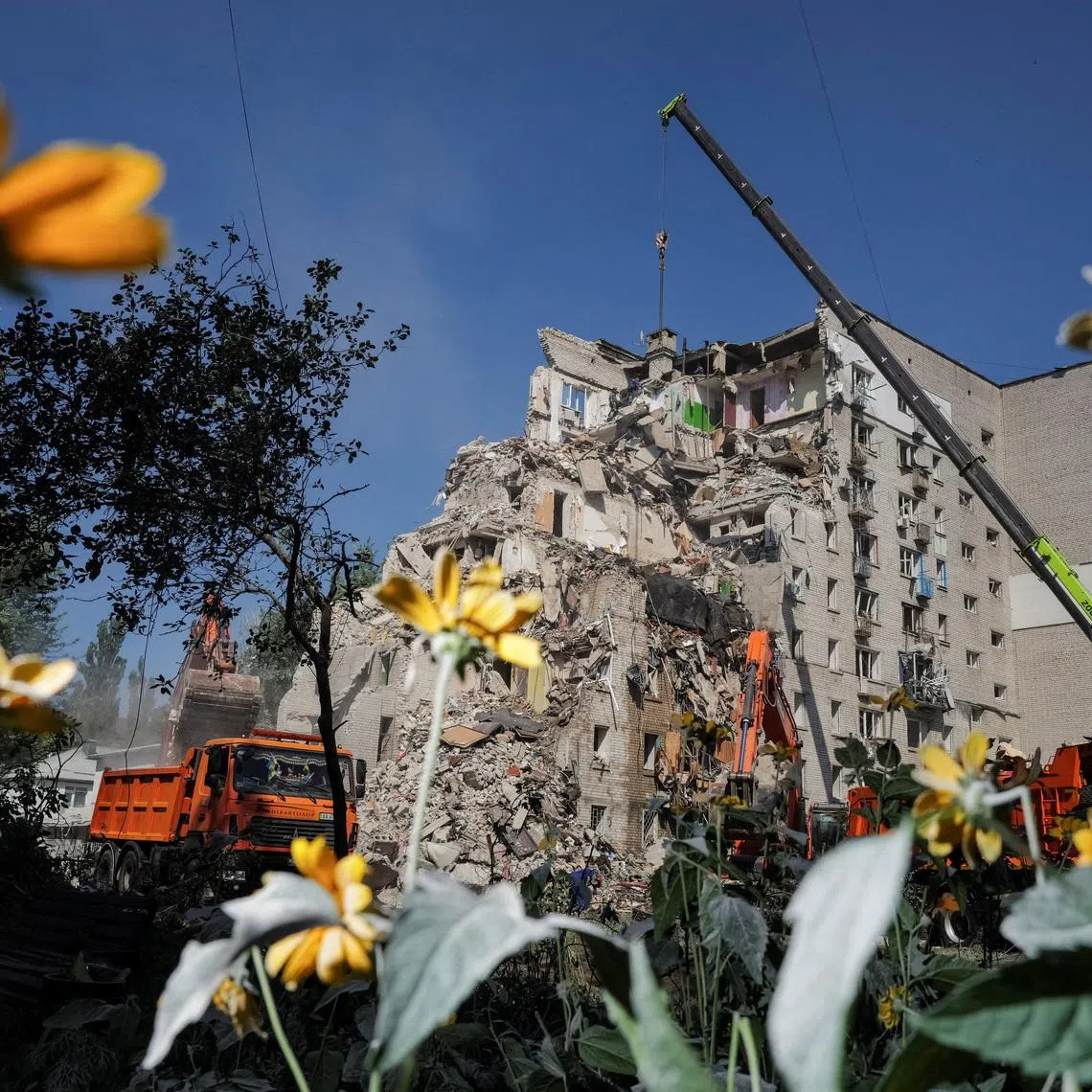 Rescuers working at the site of an apartment building damaged during a Russian missile and drone strike, amid Russia’s attack on Ukraine, in Kyiv, on July 2.