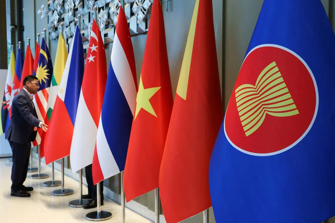 The ASEAN flag is placed alongside the flags of its member countries ahead of the ASEAN Foreign Ministers' Retreat in Langkawi, Malaysia January 17, 2025. REUTERS/Hasnoor Hussain