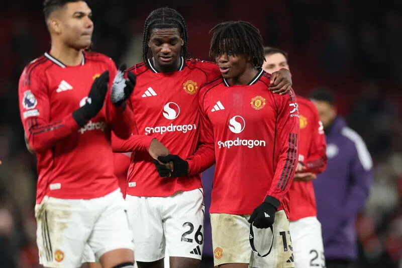 Ayden Heaven of Manchester United (centre) and Patrick Dorgu of Manchester United (right) react after the match on Dec 26.