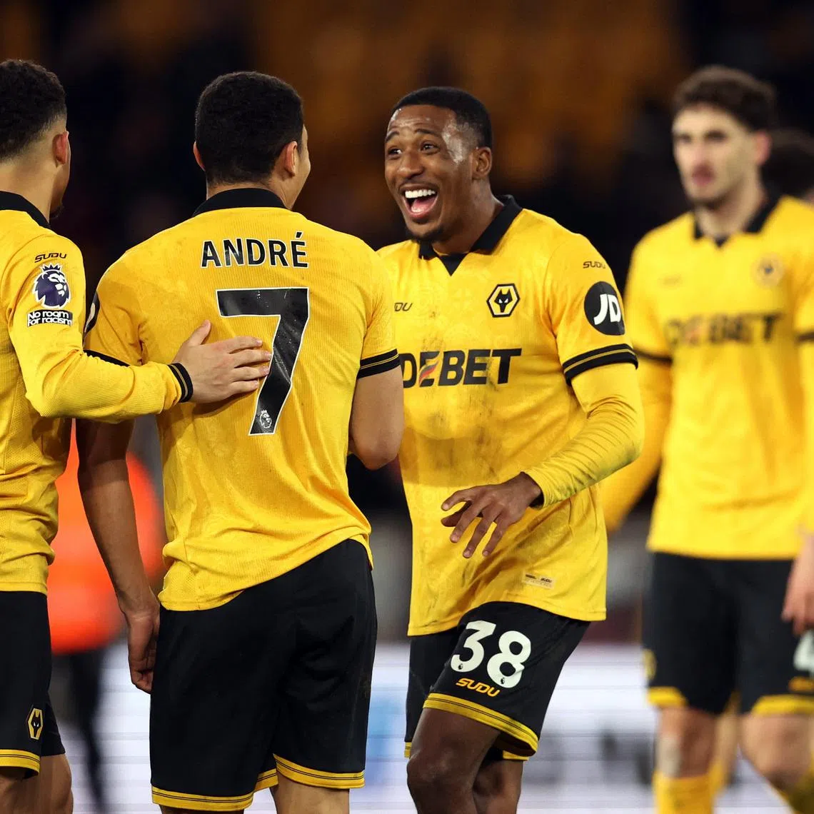 Soccer Football - Premier League - Wolverhampton Wanderers v Liverpool - Molineux Stadium, Wolverhampton, Britain - March 3, 2026 Wolverhampton Wanderers' Andre, Joao Gomes and Jackson Tchatchoua celebrate after the match REUTERS/Chris Radburn