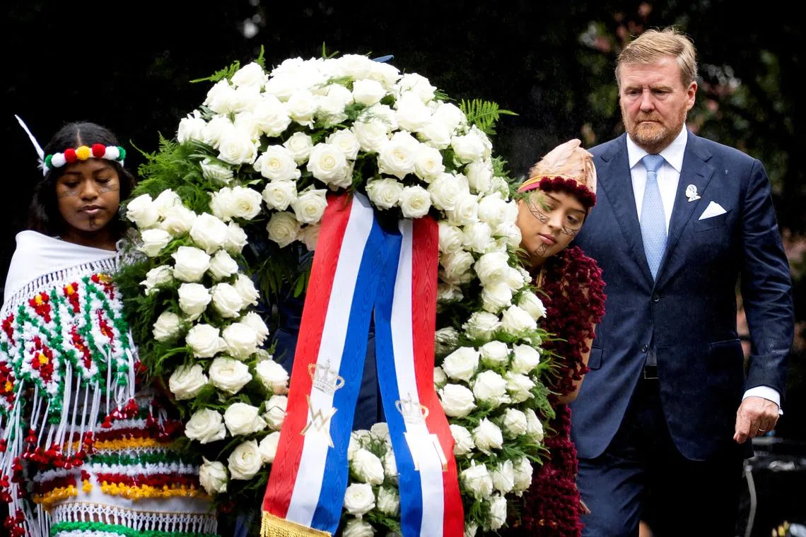 The Netherlands' King Willem-Alexander lays a wreath during the National Remembrance Day of Slavery.