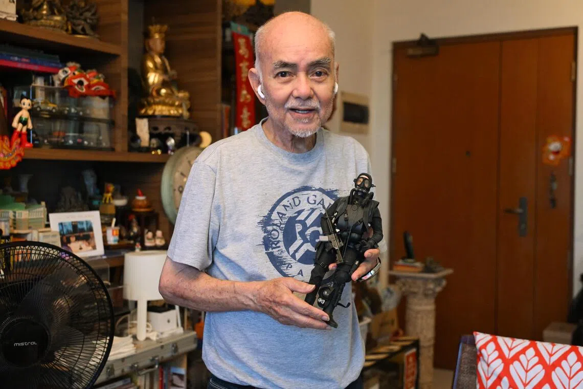 Wong with a figurine of a naval diver. An avid collector for decades, Wong helps his younger daughter run a vintage store.