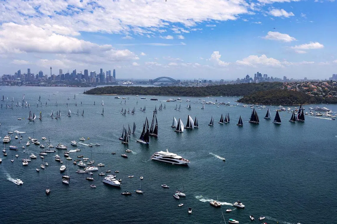 TOPSHOT - This handout image taken and received from Rolex on December 26, 2023 shows yachts competing at the start of the annual Sydney to Hobart yacht race on Boxing Day on Sydney Harbour. (Photo by Andrea Francolini / ROLEX / AFP) / RESTRICTED TO EDITORIAL USE - MANDATORY CREDIT "AFP PHOTO / ROLEX / ANDREA FRANCOLINI" - NO MARKETING NO ADVERTISING CAMPAIGNS - DISTRIBUTED AS A SERVICE TO CLIENTS