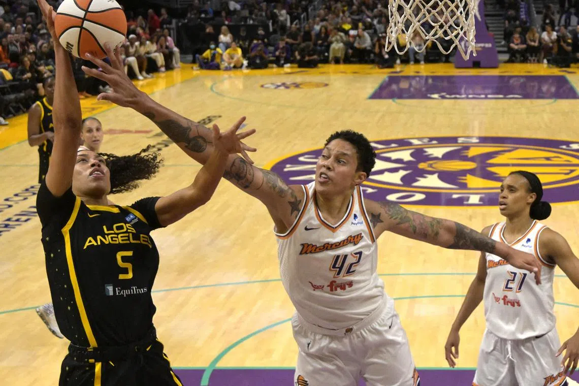 Phoenix Mercury center Brittney Griner blocks a shot by Los Angeles Sparks guard Dearica Hamby n the first half at Crypto.com Arena.