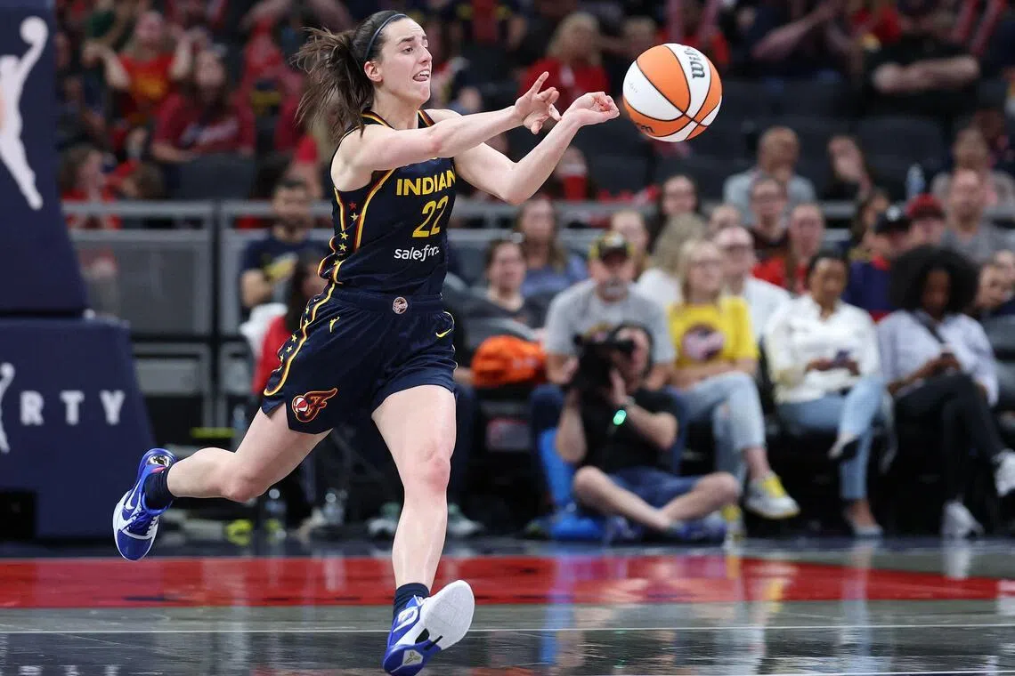 Caitlin Clark of the Indiana Fever passes the ball against the Seattle Storm in their WNBA game at Gainbridge Fieldhouse in Indianapolis, Indiana on May 17, 2026.