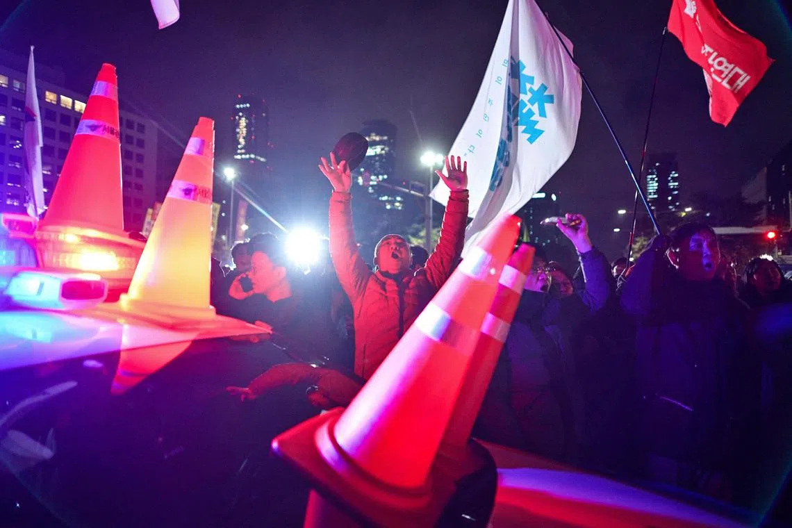 People gathering outside the National Assembly in Seoul on Dec 4, 2024, after S
